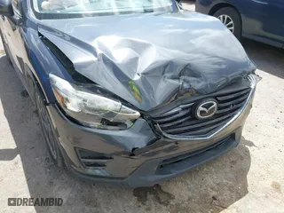 2016 Mazda CX-5 Grand Touring with VIN JM3KE4DY7G0643643, listed as a IAAI auction lot 42077497 with 120,343 mi miles. Bid and sale history available at carsss.com. Image 17.