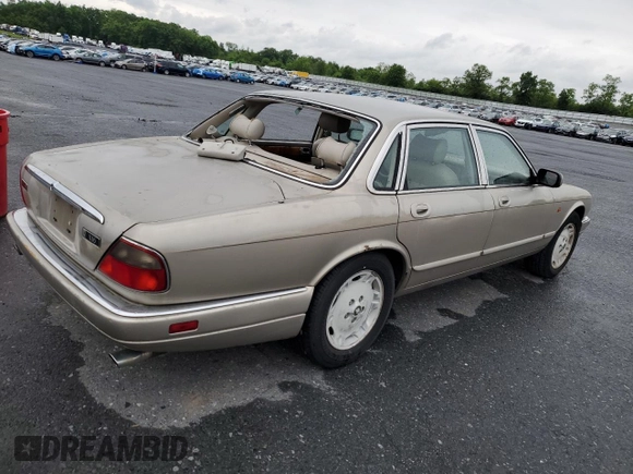 1995 Jaguar XJ with VIN SAJHX174XSC738856, listed as a Copart auction lot 57768915 with Not provided miles and Salvage title. Bid and sale history available at DreamBid. Image 3.