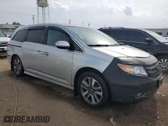 2014 Honda Odyssey Touring with VIN 5FNRL5H93EB034263, listed as a Copart auction lot 57254485 with 150,084 mi miles and Salvage title. Bid and sale history available at DreamBid. Image 4.