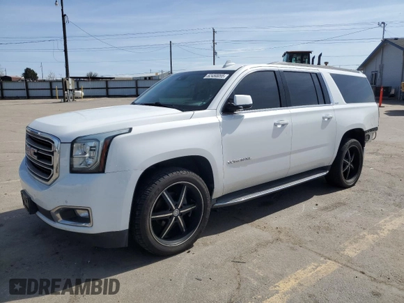 2016 GMC Yukon XL SLT with VIN 1GKS2GKC6GR228033, listed as a Copart auction lot 52450055 with 135,476 mi miles and Salvage Title. Bid and sale history available at DreamBid. Image 1.