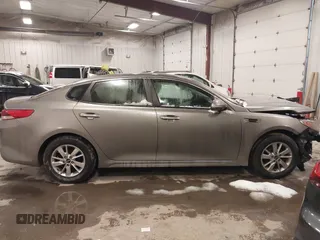 2017 Kia Optima LX with VIN 5XXGT4L33HG148897, listed as a IAAI auction lot 41565592 with 61,471 mi miles and . Bid and sale history available at carsss.com. Image 14.