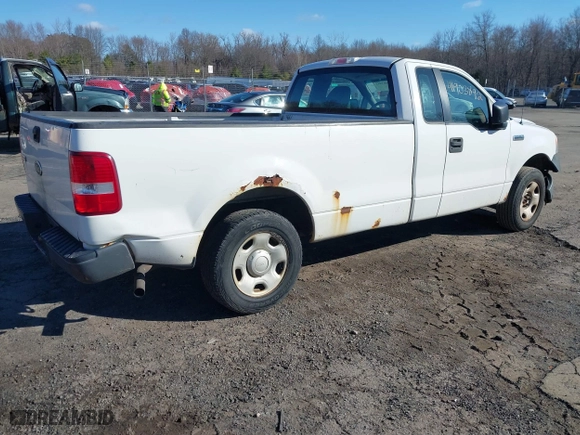 2005 Ford F-150 XL with VIN 1FTRF12285NB41452, listed as a IAAI auction lot 41903892 with 290,233 mi miles. Bid and sale history available at carsss.com. Image 4.