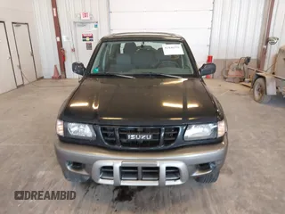 2002 Isuzu Rodeo z VIN 4S2CM57W124335034, wystawiony jako IAAI lot #42446556 z przebiegiem 214 718 mil mil oraz . Historia ofert i sprzedaży dostępna na DreamBid. Obrazek 6.