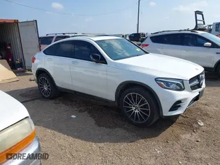 2019 Mercedes-Benz GLC with VIN WDC0J4KB2KF667133, listed as a IAAI auction lot 41444410 with 76,789 mi miles. Bid and sale history available at carsss.com. Image 1.