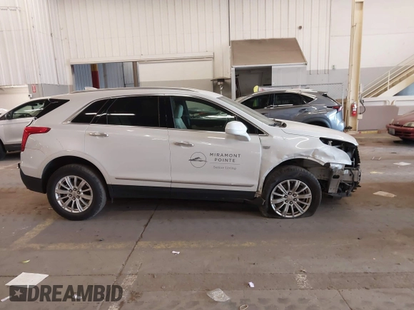 2017 Cadillac XT5 FWD with VIN 1GYKNARS7HZ121596, listed as a IAAI auction lot 41825879 with 82,023 mi miles and . Bid and sale history available at DreamBid. Image 14.