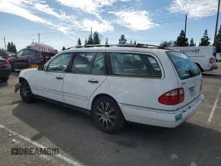 1999 Mercedes-Benz E-Class with VIN WDBJH65F3XA749696, listed as a Copart auction lot 77656084 with 163,802 mi miles and Salvage Title. Bid and sale history available at carsss.com. Image 2.