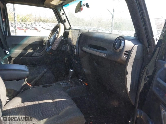 2012 Jeep Wrangler Unlimited Sport with VIN 1C4BJWDG5CL209978, listed as a IAAI auction lot 41662081 with 202,282 mi miles. Bid and sale history available at carsss.com. Image 5.