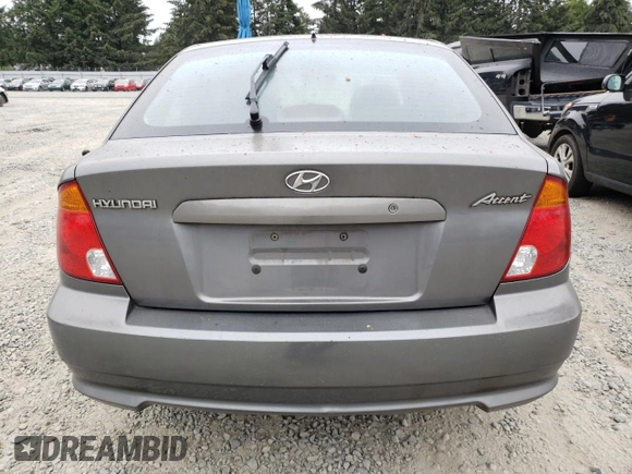 2004 Hyundai Accent GL with VIN KMHCG35C44U299645, listed as a Copart auction lot 63728174 with 159,604 mi miles and Clean Title. Bid and sale history available at carsss.com. Image 6.