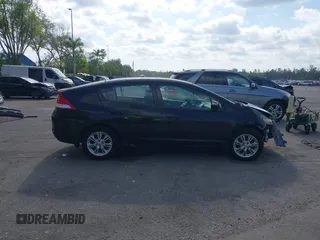 2010 Honda Insight EX with VIN JHMZE2H76AS000837, listed as a IAAI auction lot 42103333 with 146,576 mi miles and . Bid and sale history available at DreamBid. Image 13.