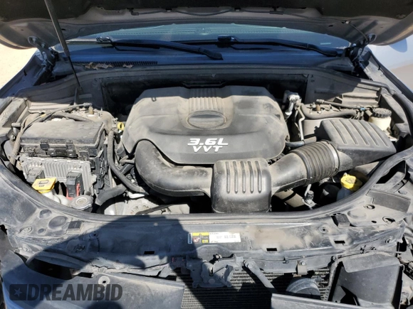 2014 Jeep Grand Cherokee Overland with VIN 1C4RJFCG7EC153156, listed as a Copart auction lot 52452925 with 152,348 mi miles and Salvage Title. Bid and sale history available at DreamBid. Image 12.