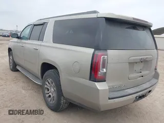 2015 GMC Yukon XL SLE z VIN 1GKS1GKC1FR155056, wystawiony jako IAAI lot #41517607 z przebiegiem 174 634 mil mil oraz . Historia ofert i sprzedaży dostępna na DreamBid. Obrazek 3.