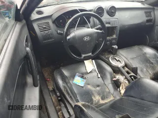 2003 Hyundai Tiburon GT z VIN KMHHN65F83U101784, wystawiony jako Copart lot #41566805 z przebiegiem 99 970 mil mil oraz Nie do naprawy • Non repairable. Historia ofert i sprzedaży dostępna na DreamBid. Obrazek 8.