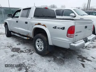 2004 Dodge Dakota SLT with VIN 1D7HG48N34S665027, listed as a IAAI auction lot 41395509 with 128,064 mi miles. Bid and sale history available at carsss.com. Image 3.