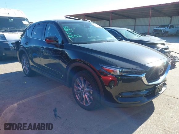 2021 Mazda CX-5 Grand Touring with VIN JM3KFADM1M0406098, listed as a IAAI auction lot 41654735 with 33,050 mi miles. Bid and sale history available at carsss.com. Image 1.