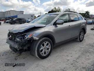 2015 Mazda CX-9 Touring with VIN JM3TB2CA1F0467659, listed as a Copart auction lot 56553015 with 102,028 mi miles and Salvage Title. Bid and sale history available at DreamBid. Image 1.