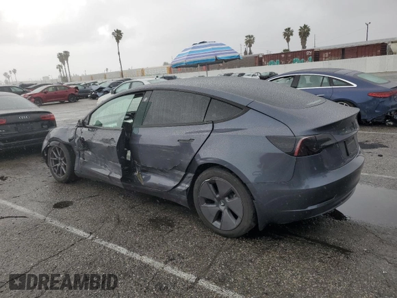 2023 Tesla Model 3 with VIN 5YJ3E1EA5PF640805, listed as a Copart auction lot 48389265 with 28,193 mi miles and Salvage title. Bid and sale history available at DreamBid. Image 2.