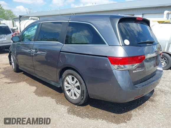 2014 Honda Odyssey EX-L with VIN 5FNRL5H60EB117218, listed as a IAAI auction lot 42201739 with 184,586 mi miles and . Bid and sale history available at DreamBid. Image 3.