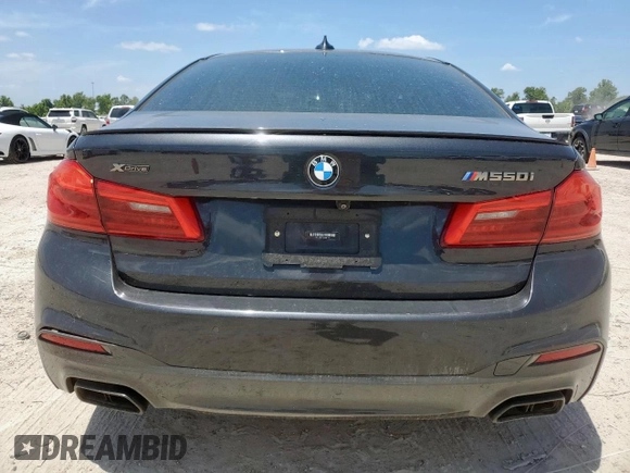 2019 BMW 5 Series M550i xDrive with VIN WBAJB9C51KB287797, listed as a Copart auction lot 65382465 with 61,459 mi miles and Salvage title. Bid and sale history available at DreamBid. Image 6.