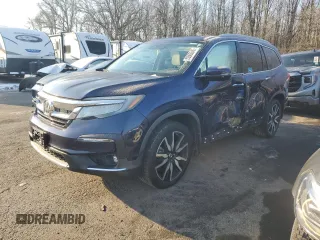 2019 Honda Pilot Touring 8-Passenger z VIN 5FNYF6H97KB011458, wystawiony jako Copart lot #89063945 z przebiegiem 101 825 mil mil oraz Szkoda całkowita • Salvage title. Historia ofert i sprzedaży dostępna na DreamBid. Obrazek 1.