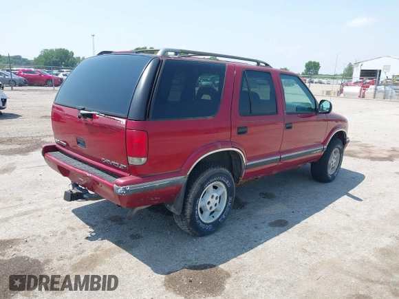 1997 Chevrolet Blazer LS z VIN 1GNDT13W6V2243751, wystawiony jako IAAI lot #42437683 z przebiegiem 148 262 mil mil oraz . Historia ofert i sprzedaży dostępna na DreamBid. Obrazek 4.