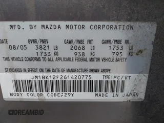 2006 Mazda 3 i with VIN JM1BK12F261420775, listed as a IAAI auction lot 42031576 with 145,530 mi miles. Bid and sale history available at carsss.com. Image 9.
