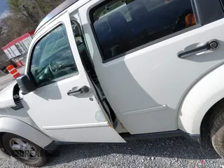 2007 Dodge Nitro SXT with VIN 1D8GU28K77W727391, listed as a IAAI auction lot 41869288 with 214,920 mi miles. Bid and sale history available at carsss.com. Image 20.