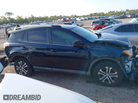 2018 Toyota RAV4 LE with VIN JTMZFREV1JJ203943, listed as a IAAI auction lot 41921863 with 104,691 mi miles. Bid and sale history available at carsss.com. Image 13.