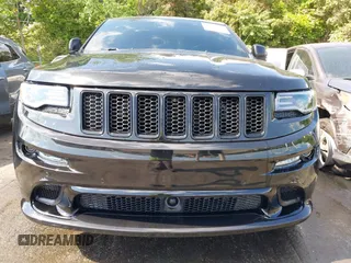 2014 Jeep Grand Cherokee SRT-8 z VIN 1C4RJFDJ2EC174412, wystawiony jako IAAI lot #42116541 z przebiegiem 124 693 mil mil oraz . Historia ofert i sprzedaży dostępna na DreamBid. Obrazek 6.