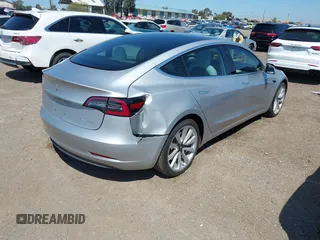 2018 Tesla Model 3 Long Range Battery with VIN 5YJ3E1EB5JF100578, listed as a IAAI auction lot 41959766 with 57,931 mi miles and . Bid and sale history available at DreamBid. Image 4.