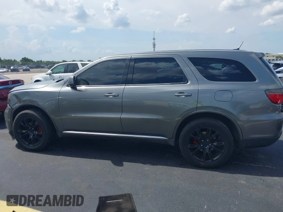 2013 Dodge Durango SXT with VIN 1C4RDHAGXDC500144, listed as a IAAI auction lot 42693122 with 194,519 mi miles and . Bid and sale history available at DreamBid. Image 14.