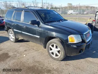 2009 GMC Envoy SLT with VIN 1GKDT43S792132160, listed as a IAAI auction lot 41876839 with 203,236 mi miles. Bid and sale history available at carsss.com. Image 1.