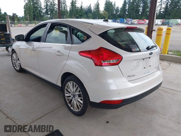 2018 Ford Focus Titanium z VIN 1FADP3N27JL314856, wystawiony jako IAAI lot #42553390 z przebiegiem 82 936 mil mil oraz . Historia ofert i sprzedaży dostępna na DreamBid. Obrazek 3.