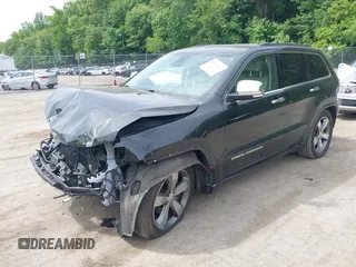 2015 Jeep Grand Cherokee Overland z VIN 1C4RJFCG3FC753772, wystawiony jako IAAI lot #42357411 z przebiegiem 130 970 mil mil oraz . Historia ofert i sprzedaży dostępna na DreamBid. Obrazek 17.