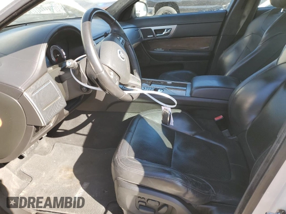 2010 Jaguar XF with VIN SAJWA0JC3AMR49540, listed as a Copart auction lot 87475704 with 137,274 mi miles and Salvage Title. Bid and sale history available at DreamBid. Image 7.