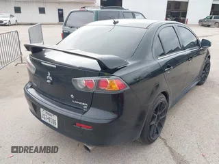 2016 Mitsubishi Lancer GT with VIN JA32U8FW8GU011501, listed as a IAAI auction lot 41779016 with 153,082 mi miles. Bid and sale history available at carsss.com. Image 4.