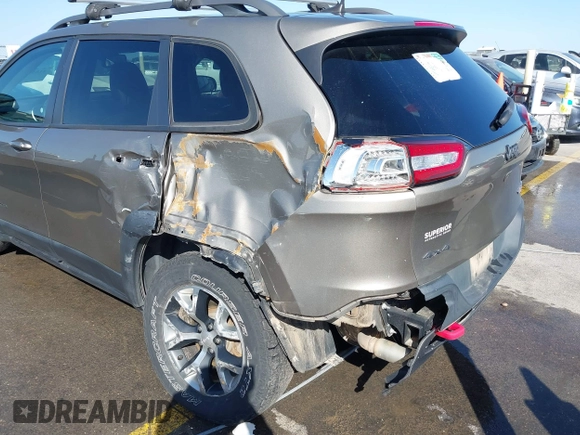2017 Jeep Cherokee Trailhawk L Plus with VIN 1C4PJMBB6HW654172, listed as a IAAI auction lot 41851236 with 104,263 mi miles. Bid and sale history available at carsss.com. Image 6.