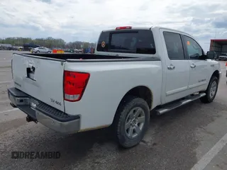 2011 Nissan Titan SL with VIN 1N6AA0EC7BN313599, listed as a IAAI auction lot 41888934 with 182,894 mi miles. Bid and sale history available at carsss.com. Image 4.