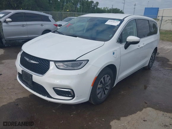 2023 Chrysler Pacifica Hybrid Touring L with VIN 2C4RC1L74PR541551, listed as a IAAI auction lot 42028927 with 57,772 mi miles. Bid and sale history available at carsss.com. Image 17.