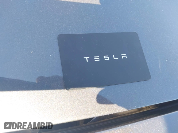 2023 Tesla Model 3 with VIN 5YJ3E1EA9PF673399, listed as a IAAI auction lot 42392643 with 7,571 mi miles and . Bid and sale history available at DreamBid. Image 11.