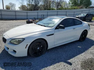 2012 BMW 6 Series 650i with VIN WBALX3C59CC528752, listed as a Copart auction lot 50835205 with 99,760 mi miles and Salvage Title. Bid and sale history available at carsss.com. Image 1.