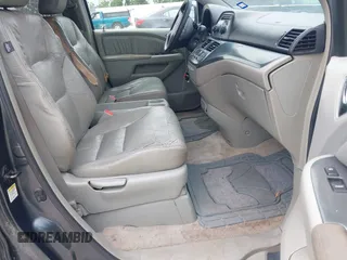 2005 Honda Odyssey EX-L z VIN 5FNRL38645B115699, wystawiony jako IAAI lot #42212481 z przebiegiem 236 420 mil mil oraz . Historia ofert i sprzedaży dostępna na DreamBid. Obrazek 5.