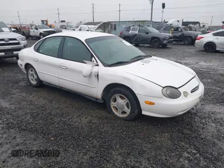 1999 Ford Taurus SE with VIN 1FAFP53U5XA269767, listed as a IAAI auction lot 41504302 with 182,198 mi miles. Bid and sale history available at carsss.com. Image 1.