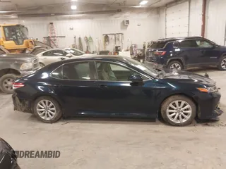 2020 Toyota Camry LE with VIN 4T1C11AK5LU926564, listed as a IAAI auction lot 41864812 with 104,212 mi miles and . Bid and sale history available at carsss.com. Image 13.