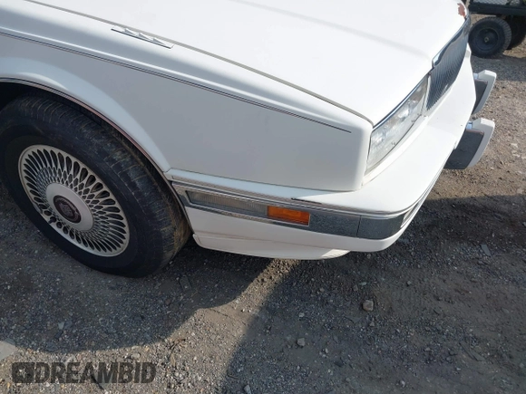 1991 Cadillac Seville z VIN 1G6KS53B9MU820155, wystawiony jako IAAI lot #40035441 z przebiegiem 78 021 mil mil oraz . Historia ofert i sprzedaży dostępna na DreamBid. Obrazek 12.