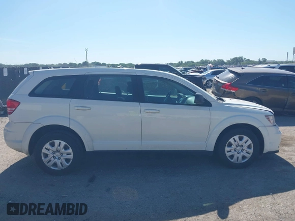2014 Dodge Journey SE with VIN 3C4PDCAB2ET258681, listed as a IAAI auction lot 42558132 with 136,569 mi miles and . Bid and sale history available at DreamBid. Image 13.
