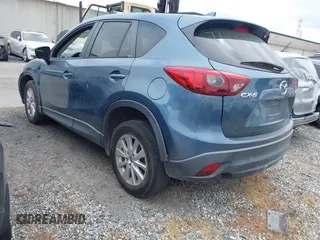 2016 Mazda CX-5 Touring z VIN JM3KE2CY2G0699138, wystawiony jako IAAI lot #42153228 z przebiegiem 144 191 mil mil oraz . Historia ofert i sprzedaży dostępna na DreamBid. Obrazek 3.