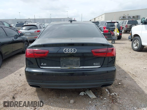 2016 Audi A6 2.0T Premium Plus with VIN WAUGFAFC1GN012799, listed as a IAAI auction lot 42141346 with 101,506 mi miles. Bid and sale history available at carsss.com. Image 16.