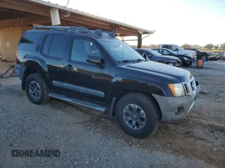 2014 Nissan Xterra X with VIN 5N1AN0NW9EN812437, listed as a Copart auction lot 83905504 with 118,805 mi miles and Salvage Title. Bid and sale history available at DreamBid. Image 4.