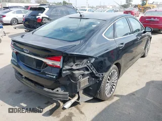 2018 Ford Fusion Titanium with VIN 3FA6P0RU6JR115236, listed as a IAAI auction lot 42111343 with 106,858 mi miles and . Bid and sale history available at DreamBid. Image 4.