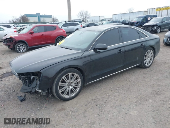 2012 Audi A8 с VIN WAUAVAFD0CN035731, выставлен на аукционе IAAI как лот 41286022 с пробегом 82 835 миль миль и . История ставок и продаж доступна на DreamBid. Изображение 2.